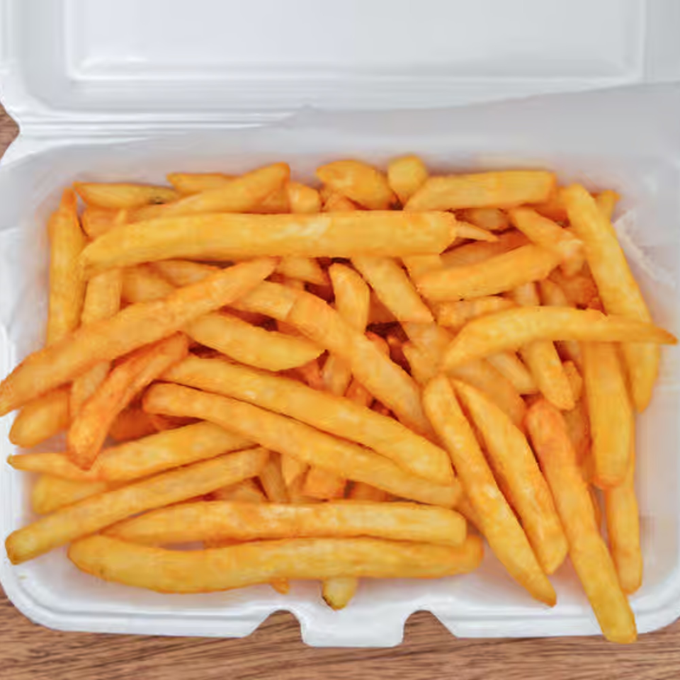Golden-brown french fries in a white takeout container from Pizza Connect & Grill.