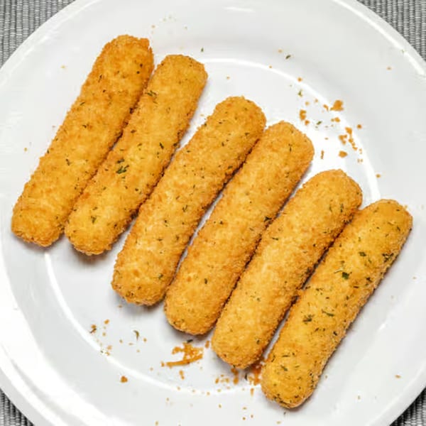 Six golden-brown mozzarella sticks, sprinkled with herbs, arranged on a white plate.